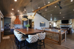 A dining room with dark accents and decor. 