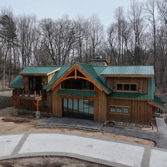 Barn house with green roof designed by Sweet Magnolia Design.